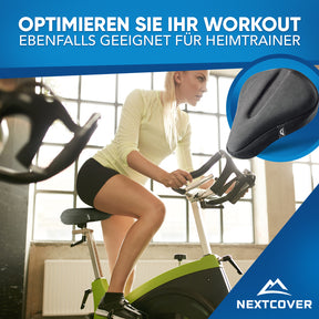 Nextcover Sattelbezug auf einem Heimtrainer – verbessert Komfort und Dämpfung für ein optimales Indoor-Workout.